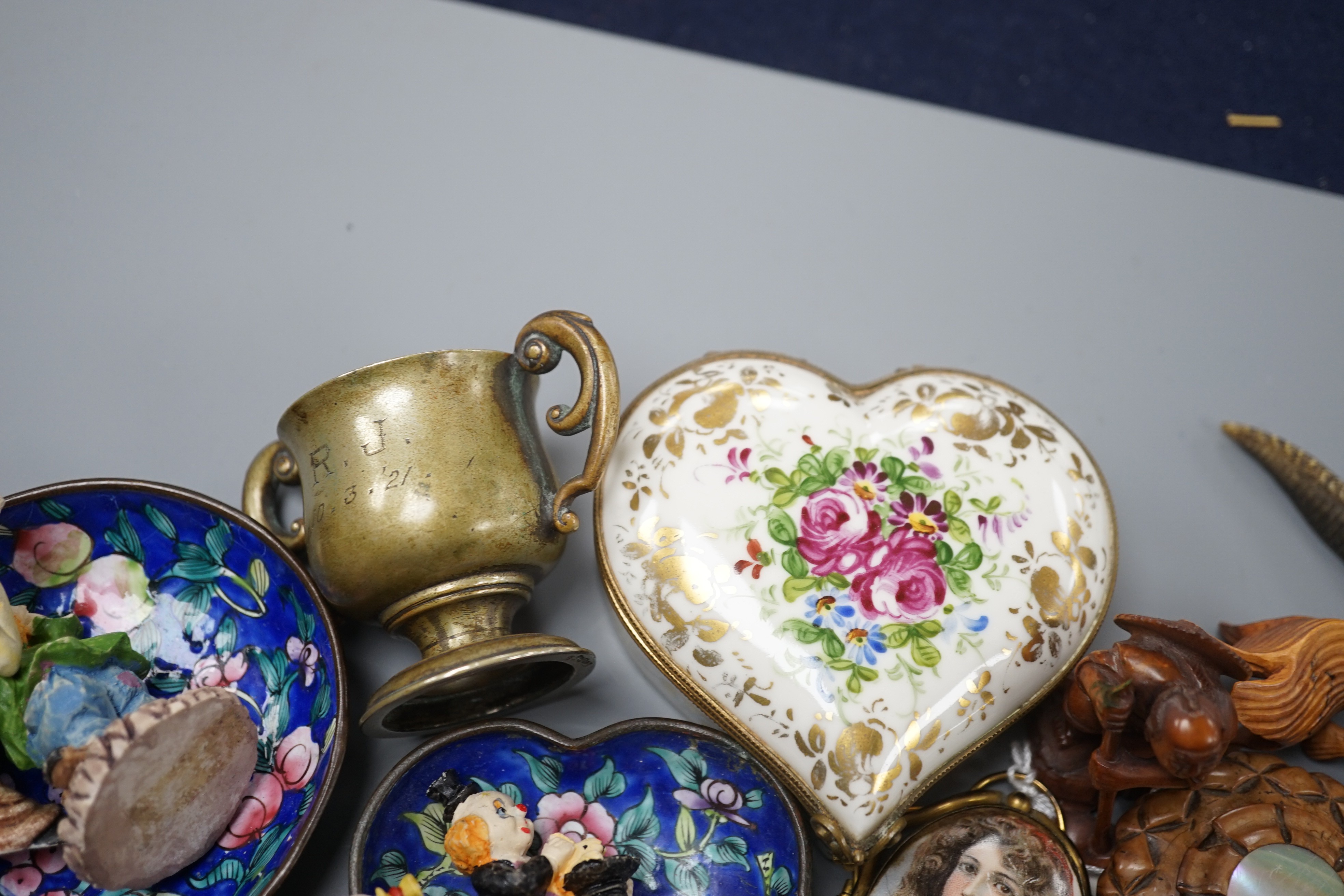 A box of small collectables including a netsuke, Canton enamelled dishes, a horn model of a crocodile, 22.5 cm long etc.